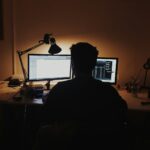 man using computer inside room