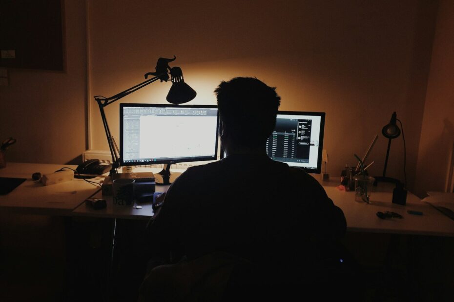 man using computer inside room